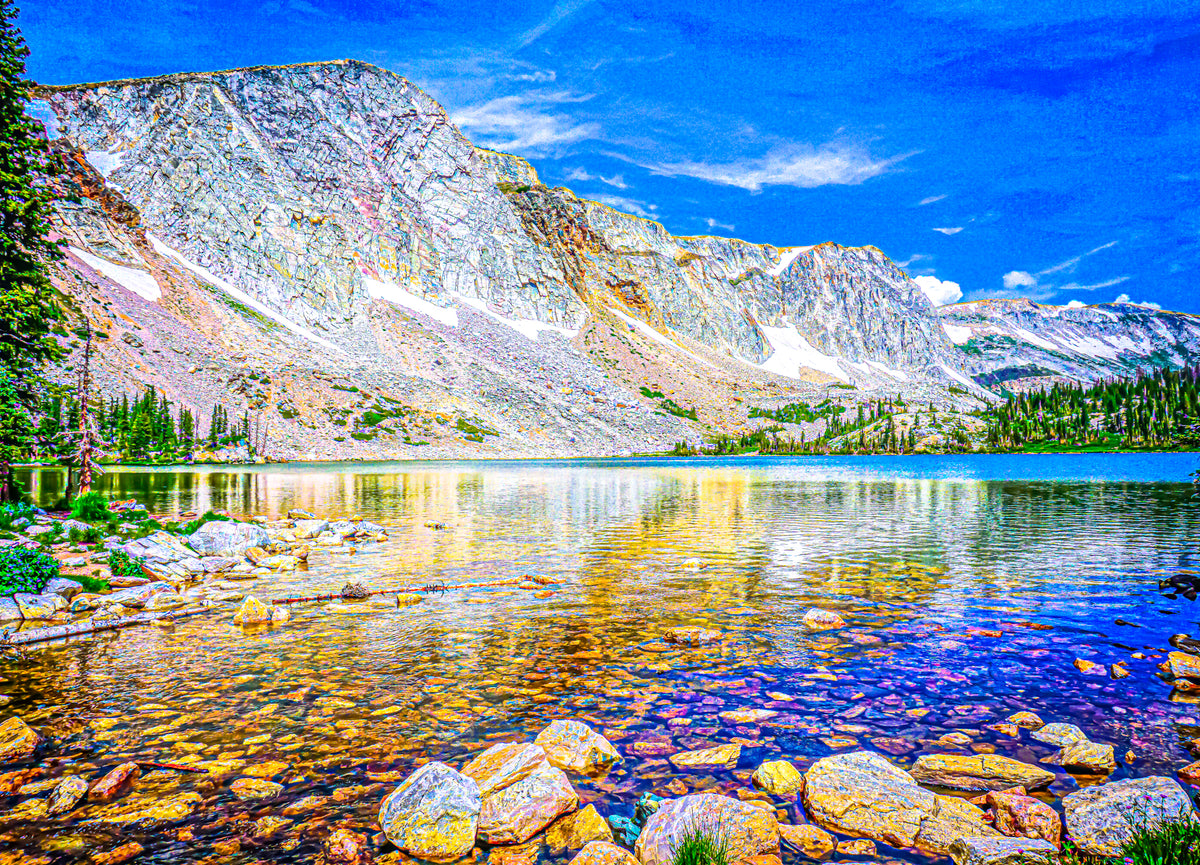 This image shows the transparency of Mirror Lake in Medicine Bow National Forest by dissecting the horizon of a water line from the massive sedimentary wall. The bright summer colors shine through in bold and subtle places like in the lake or amidst the rock faces. Lastly, the granular dimension of in the image portrays a post-impressionist style of dot-painting known as Pointillism (Link: https://artincontext.org/pointillism/).