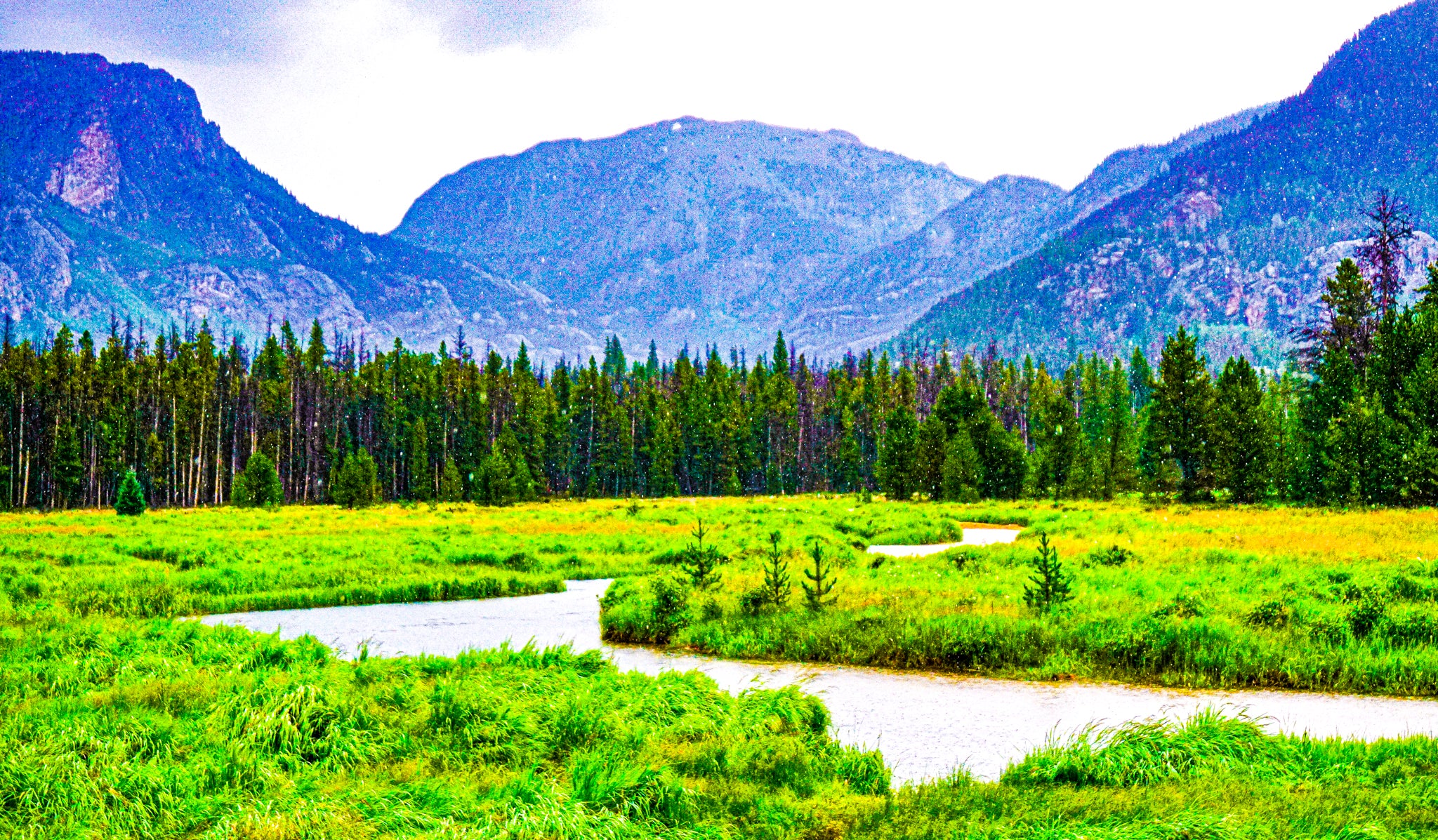 "Winding River through a Rocky Mountain Valley"